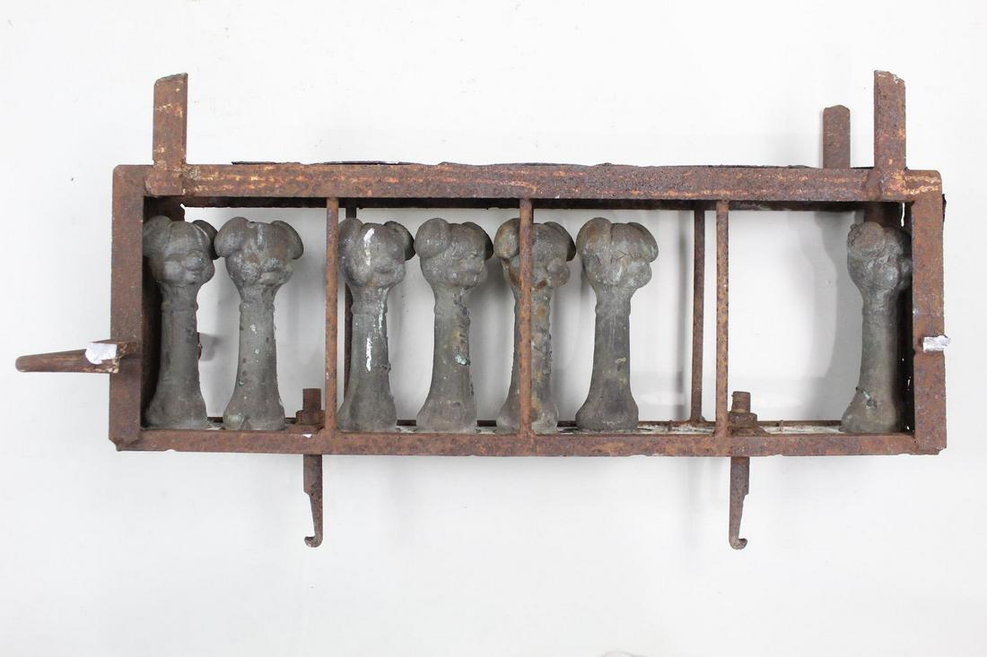 Industrial Doll Injection Molds, 7 Dog Bone Toys: Industrial Doll Injection Molds, 7 Dog Bone Toys. Seven injection molds in metal, mounted in a frame, used in factories to make toys in rubber or plastic. These molds are for making dog toys in the sh