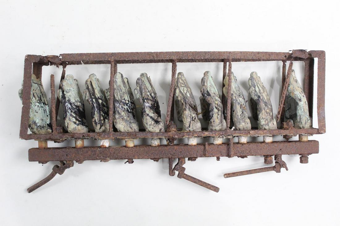 Industrial Toy Doll Injection Molds, 10 Hands (1/2): Industrial Toy Doll Injection Molds, 10 Hands (1/2). Ten injection molds in metal, mounted in a frame, used in factories to make toy hands in rubber or plastic. From the private collection of contempo