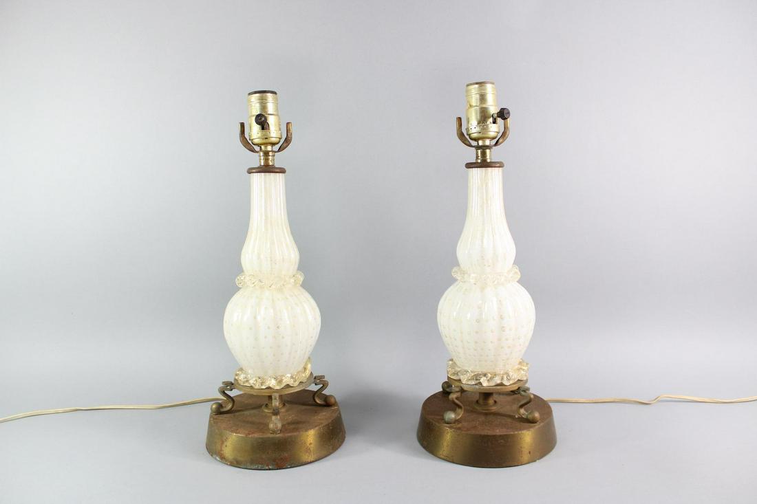 Pair of White and Gold Murano Glass Lamps, Mid Century Modern: Pair of White and Gold Murano Glass Lamps, Mid Century Modern. These nice Murano Glass lamps have gold in the glass. Dimensions are 15.75 in h x 6.25 in w x 6.25 in d. Condition is good. The metal bas