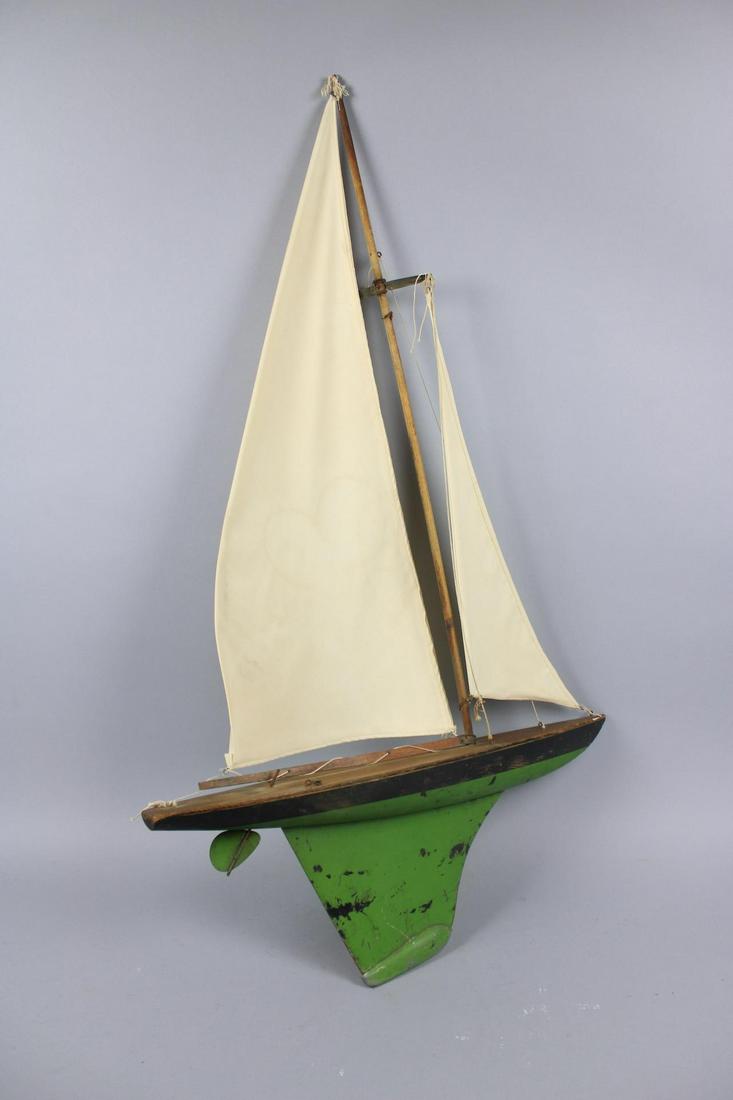 Jacrim Hollow-Boat Green Painted Sail Boat Model: Jacrim Hollow-Boat Toy Green Painted Sail Boat. This is a fantastic green painted toy sail boat model made by Keystone Mfg. Co. in Boston, Massachusets. It has a wooden frame and canvas sails. Dimensi