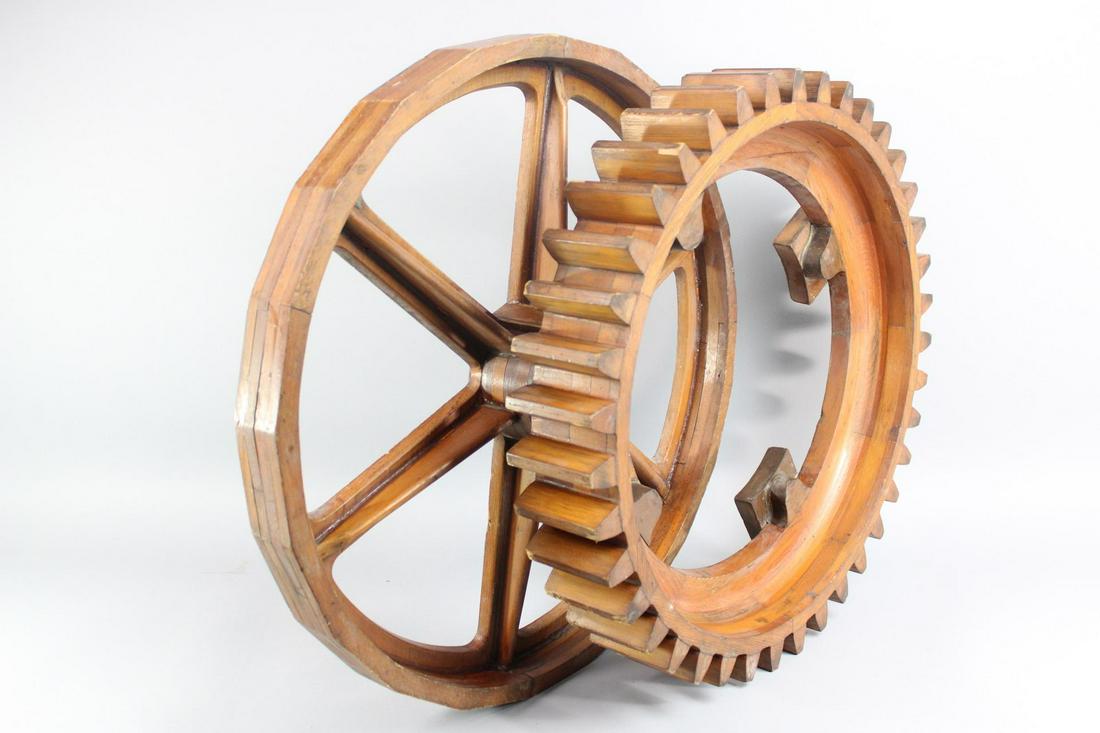 Pair of Industrial Factory Foundry Wood Gear Molds: Pair of Industrial Wood Gear Molds. This is a fantastic lot of two wooden gears that were used as industrial molds. One has teeth and one has a flat edge. Dimensions for the larger gear are 24.5 in h 