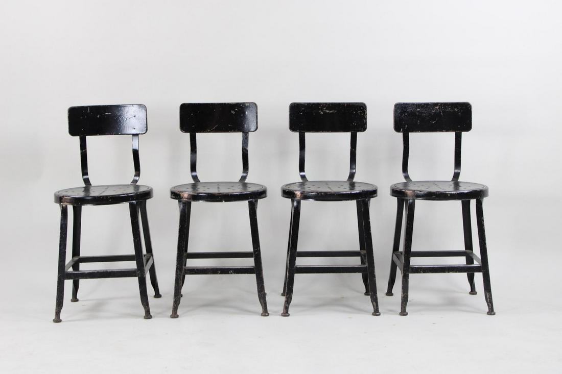 Set of 4 Industrial Black Metal Studio Drafting Chairs: Set of 4 Black Industrial Metal Studio Chairs. These black metal studio or drafting chairs have a round seat with perforations, allowing you to easily tie a cushion to top or for rain to drain through