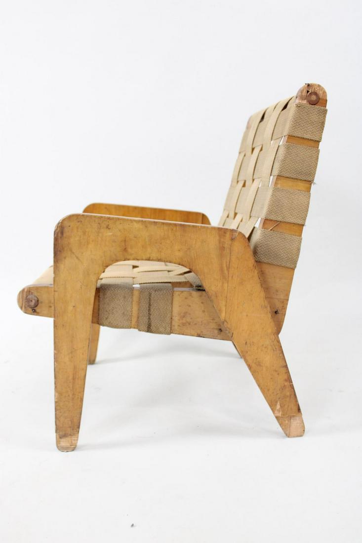 Mid Century Modern Handmade Plywood Woven Strap Child's Chair: Mid Century Modern Handmade Plywood Woven Strap Child's Chair. It is in the style of Klaus Grabe. A great little designed chair, possibly handmade. One of the woven straps is broken. Dimensions are 21