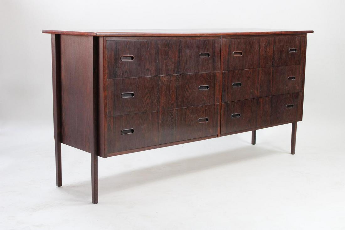 Danish Mid-Century Modern Rosewood Dresser, Credenza: Danish Modern Rosewood Dresser, Credenza. Wide and handsome credenza has 6 drawers and is marked Made in Denmark. Dimensions are 31 in h x 62 in w x 19.25 in d. Condition is good with minimal scratchi
