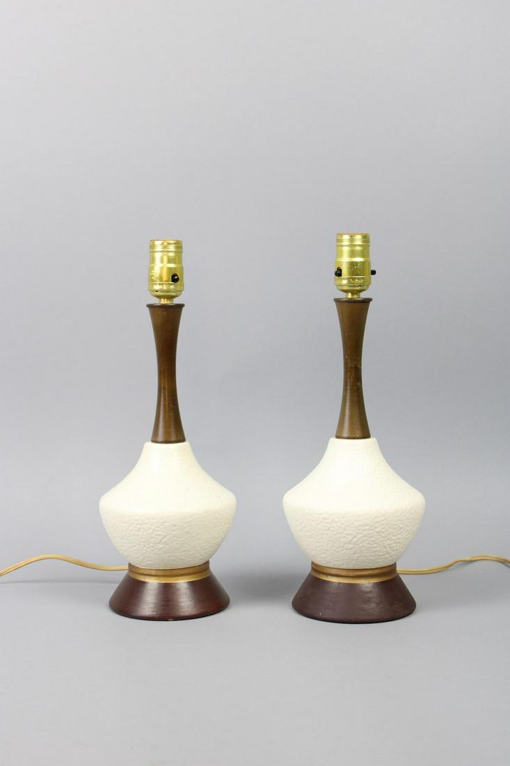 Pair of Mid-Century Modern Ceramic & Wood Genie Bottle Lamps: Pair of Mid-Century Modern Ceramic & Wood Genie Bottle Table Lamps. Matching pair are shaped like genie bottles, with a white pebble-finish ceramic center and wood and brass base & stem. No shades. Th