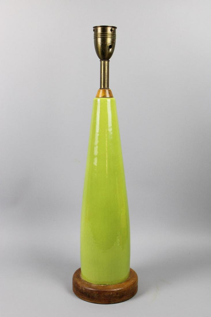 Mid-Century Modern Green Ceramic Heifetz Table Lamp: Mid-Century Modern Sign Ceramic Heifetz Table Lamp. This is a fantastic minimal table lamp. It has a slender lime green body with a brass top. It is signed, "heifetz" at the base. Dimensions are 30.5
