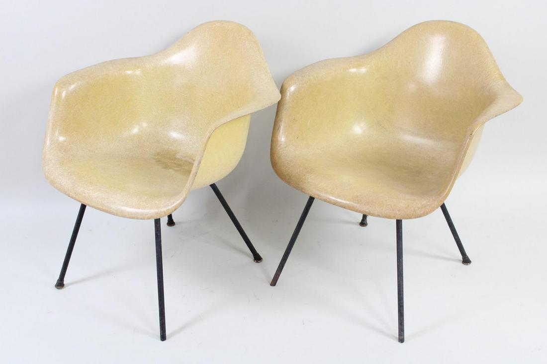 Pair of Eames Fiberglass Shell Chairs for Herman Miller Low/Lounge Height: Set of 2 Eames Fiberglass Shell Chairs for Herman Miller Low/Lounge Height. Matching pair are made of butter color fiberglass with metal bases. Herman Miller label on the undersides. Dimensions are 31