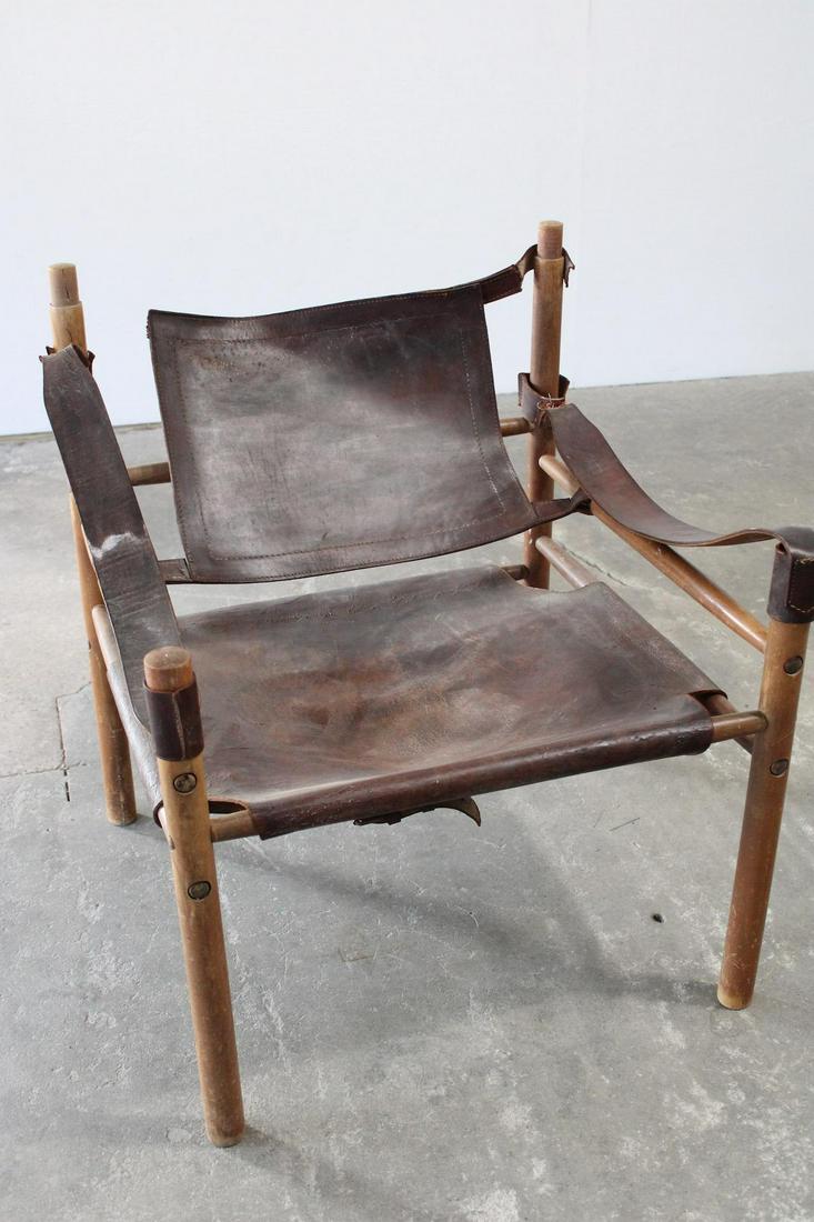 Mid Century Modern Leather Safari Sling Chair, as-is: Mid Century Modern Leather Safari Sling Chair, as-is. The chair has the arms, the seat and the back. The chairs leather back has a tear and one arm has a tear. The seat is not torn. Dimensions are 30.