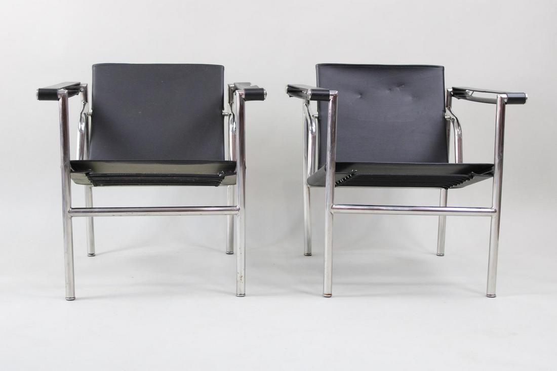 Pair of LC1 Lounge Chairs by Le Corbusier, Black Leather: Pair of LC1 Lounge Chairs by Le Corbusier. This is a classic design by Le Corbusier. Dimensions are 26 in h x 24 in w x 24 in d. Condition is very good. Minor scuffs to the leather. Please call or ema