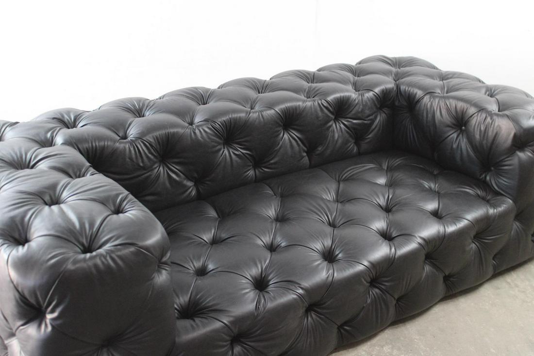 Black Tufted Leather Restoration Hardware Soho Sofa, 1 of 2: Black Tufted Leather Restoration Hardware Soho Sofa, 1 of 2. This oversized sofa is made by Restoration Hardware and called the Soho sofa. There is a matching sofa in our other lot. Dimensions are 30.