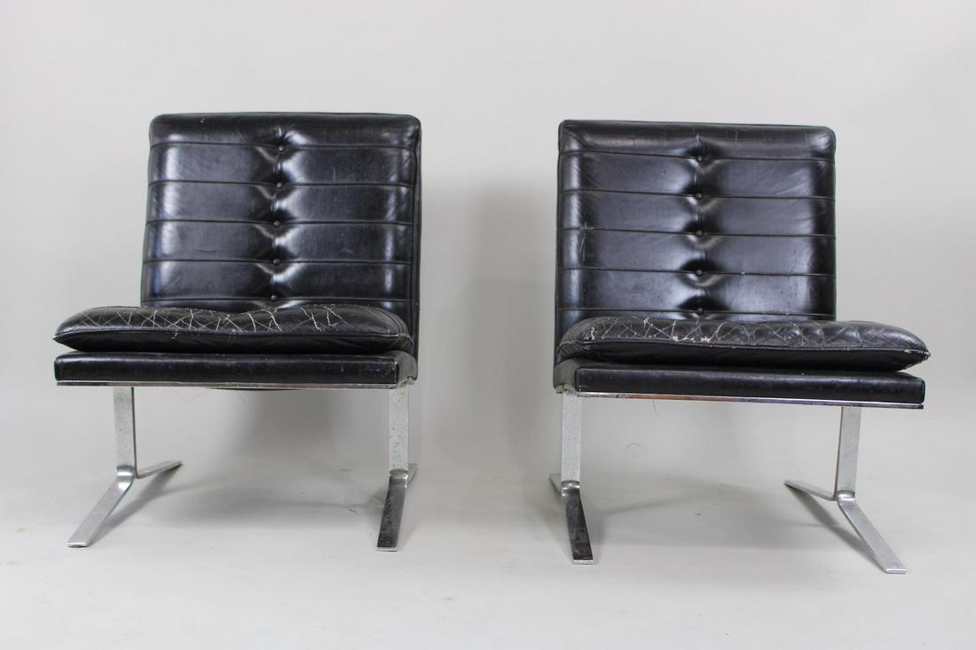 Pair of Black Leather Lounge Chairs by The Taylor Chair Co., Joker Style: Pair of Black Tufted Leather Lounge Chairs by The Taylor Chair Co.. This is a great pair of chair with nice patina to the leather. They have a tag from The Taylor Chair Co.. In the style of The Joker 
