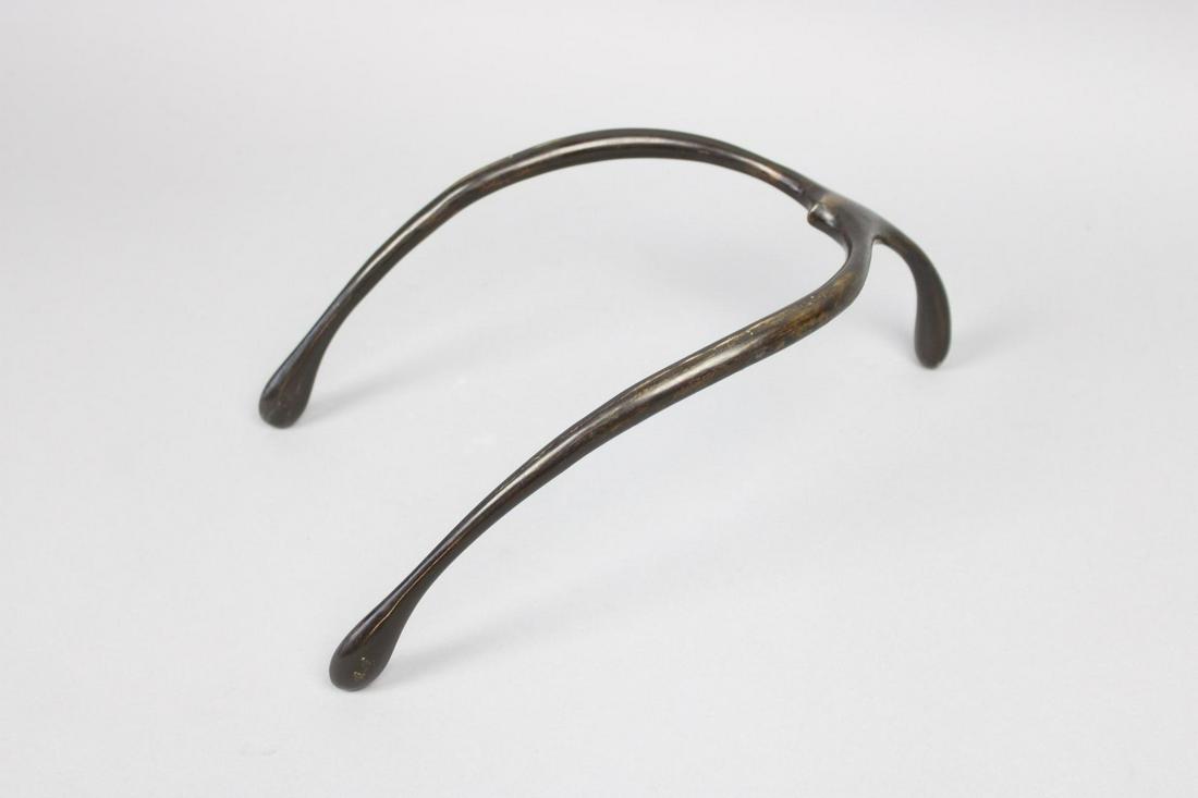 Modernist Bronze Wishbone Sculpture, Style of Carl Aubock: Modernist Bronze Wishbone Sculpture, Style of Carl Aubock. This is a large wishbone sculpture out of bronze. No marking. Dimensions are 4..5 in h x 7.5 in w x 12 in d. Condition is very good. Please c