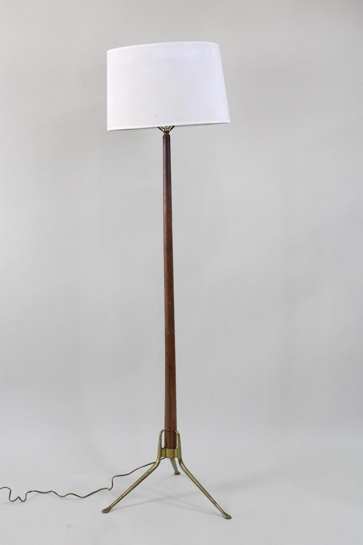 Gerald Thurston Lightolier Tripod Floor Lamp, Wood & Brass: Gerald Thurston Lightolier Floor Lamp, Wood & Brass. This floor lamp has a replaced new shade. Dimensions are 62.5 in h x 17.5 in w x 17.5 in d. Condition is good, minor oxidation to the brass. Please