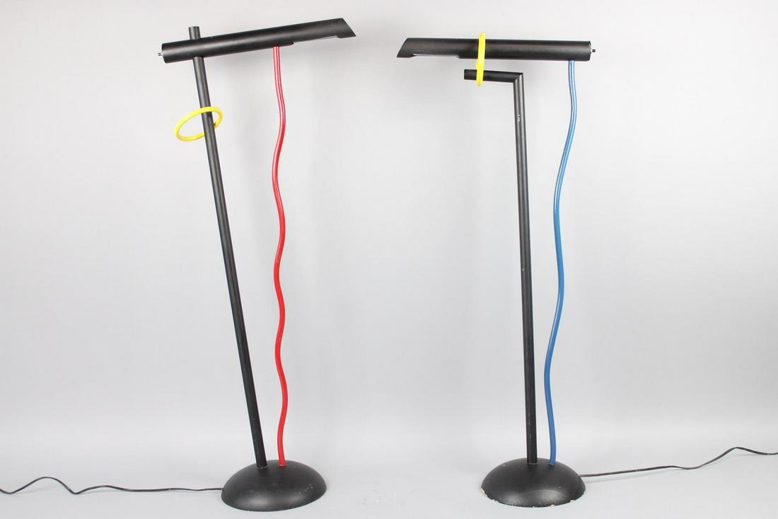 Pair of Memphis Style Black Floor Lamps, Postmodern: Pair of Memphis Style Black Floor Reading Lamps. Matched but with different details - location of yellow ring and color of vertical squiggle - these playful Memphis style floor lamps are at a good hei