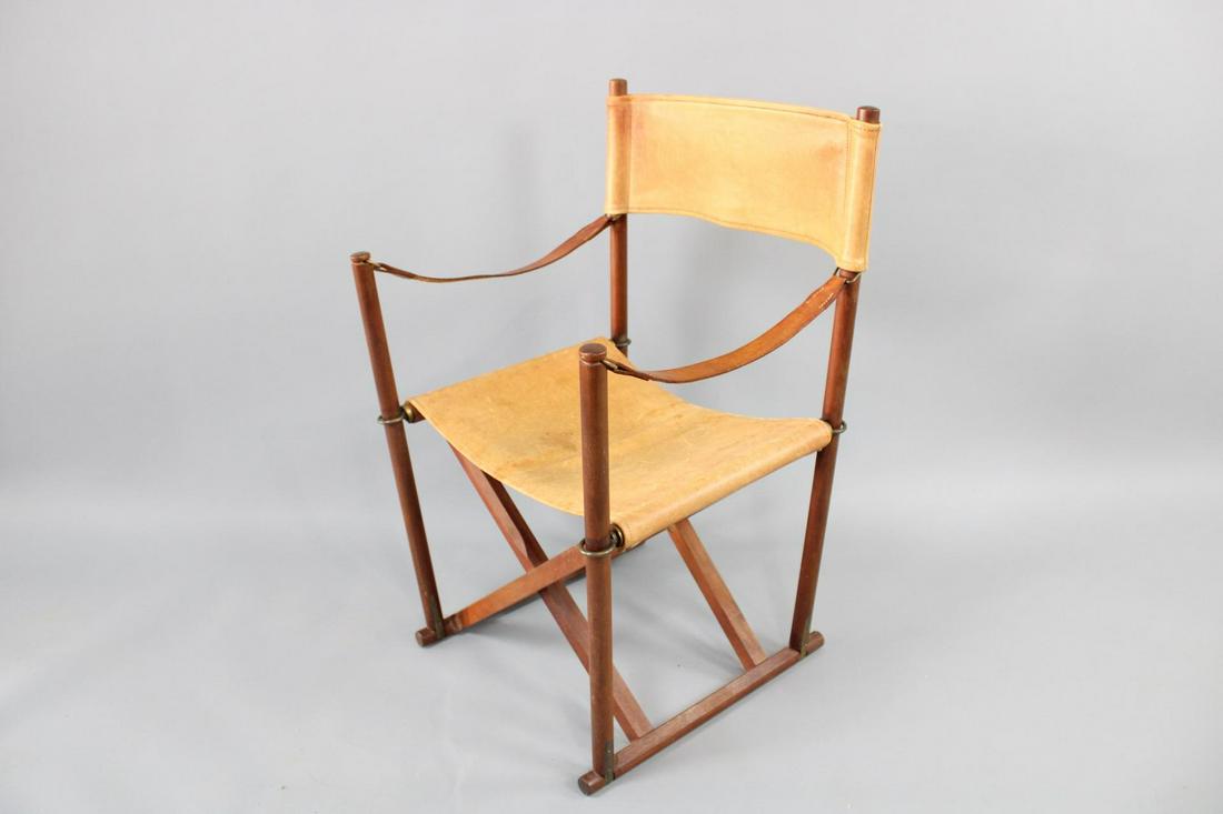 Teak Mogens Koch MK-16 Folding Leather Safari Chair, Danish Modern: Teak Mogens Koch MK-16 Folding Leather Safari Chair, Danish Modern. This interesting chair folds, is made of Teak and leather. It is marked with a metal tag Mogens Koch. Dimensions are 34.5 in h x 21
