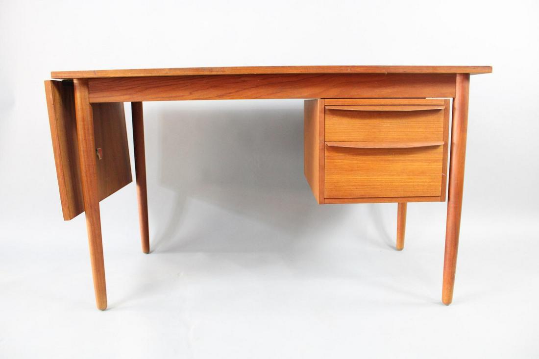 Danish Modern Teak Slide Top Desk, Arne Vodder Style: Danish Modern Teak Slide Top Desk, Arne Vodder Style. Inside the drawer is a paper label which appears to read Art Turn, Made in Denmark. Dimensions are 29 in h x 48 in w x 24 in d. When the drop leaf