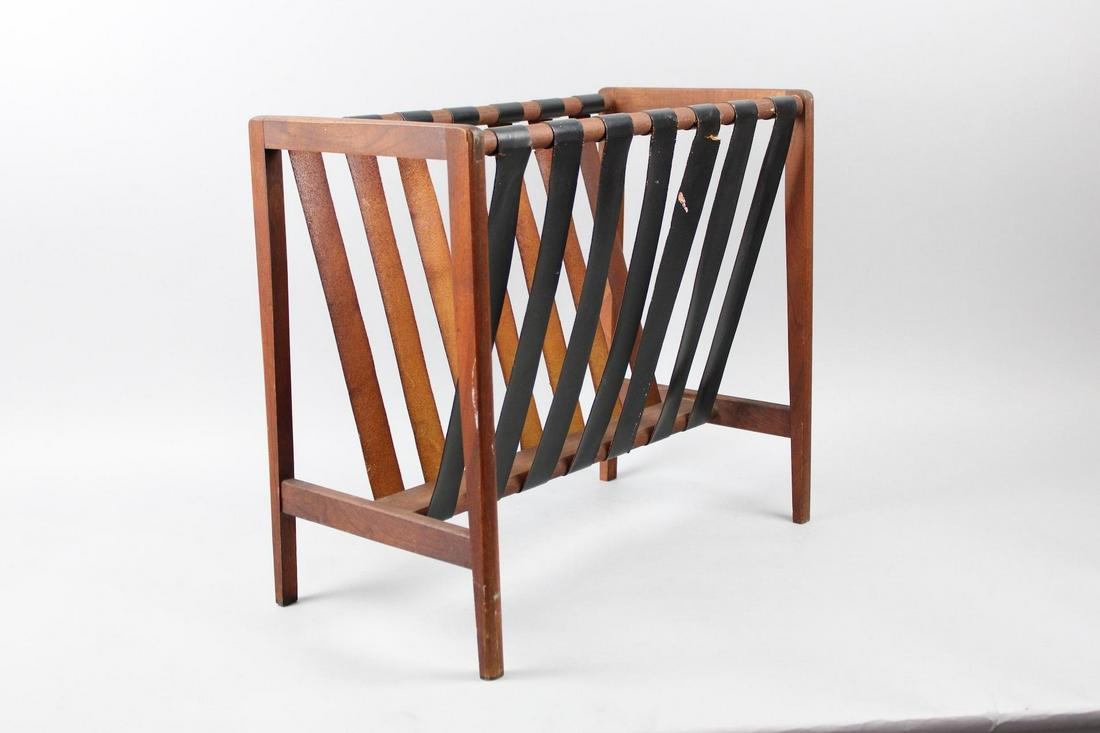 Danish Modern Magazine Rack, Wood & Leather Strap: Danish Modern Magazine Rack, Wood & Leather Strap. The one strap has a small tear but overall still very functional. Dimensions are 17.75 in h x 19.75 in w x 10.75 in d. Condition is good with the exc