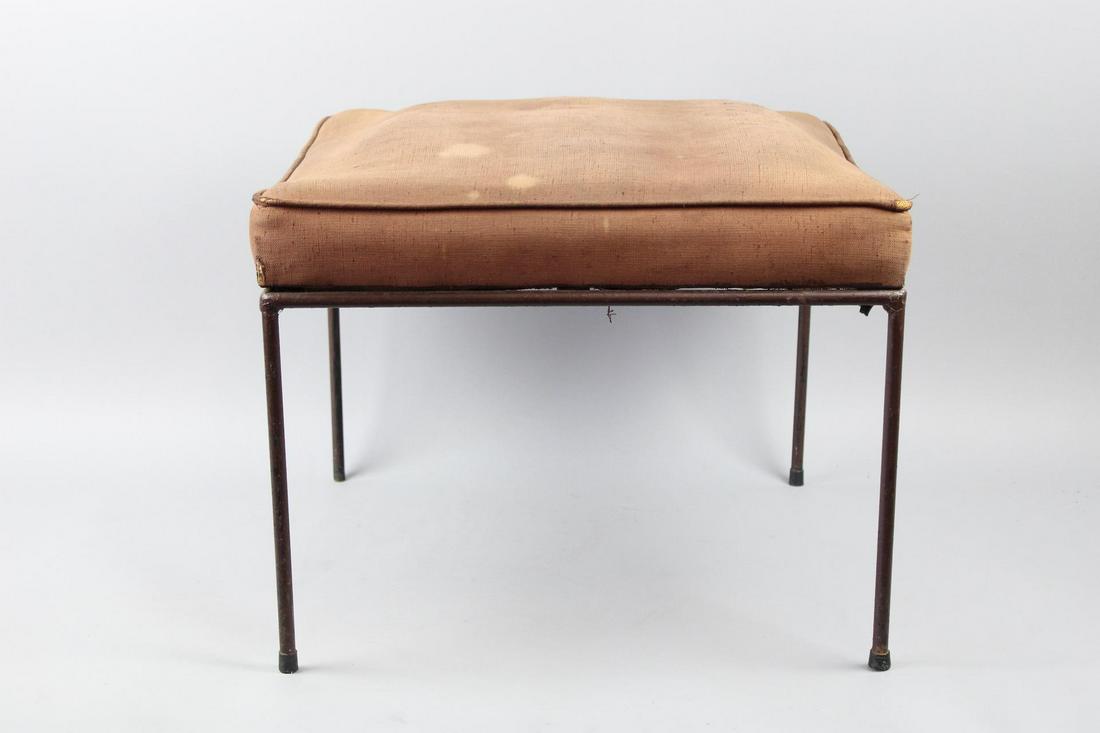 Wrought Iron Paul McCobb Ottoman Stool: Wrought Iron Paul McCobb Ottoman Stool. This iron legged stool has spring upholstered cushion that needs to be reupholstered. Dimensions are 15.5 in h x 20.5 in w x 20.5 in d. Condition is fair, needs