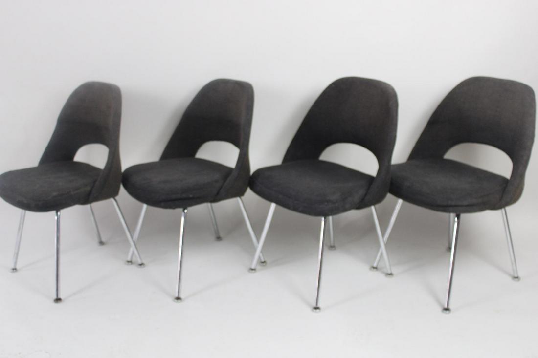 Set of 4 Eero Saarinen for Knoll Black Executive Chairs: Set of 4 Eero Saarinen for Knoll Black Executive Side Chairs. Chairs have black upholstery, with Knoll International labels on undersides. Dimensions are 32 in h x 22 in w x 21 in d. Seat height is 17