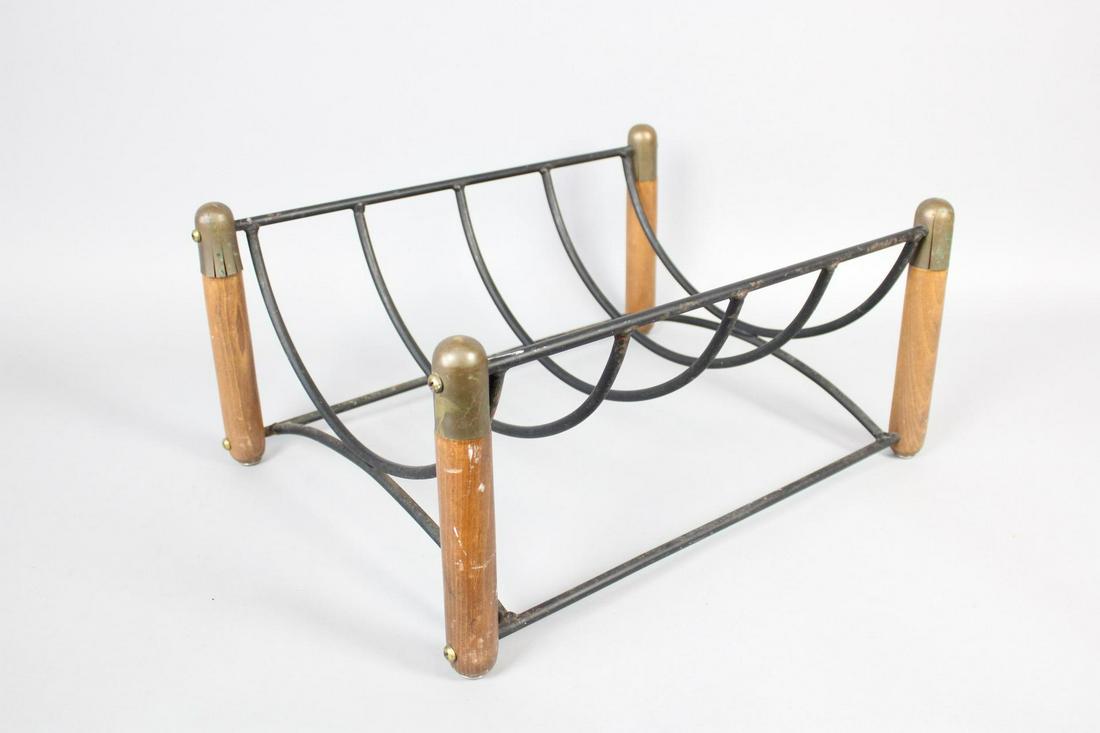 Mid Century Modern Wood & Iron Fireplace Log Holder: Mid Century Modern Wood & Iron Fireplace Log Holder. This could also be used as a magazine rack. Dimensions are 8.75 in h x 20 in w x 15.25 in d. Condition is fair. The only damage is the brass metal 