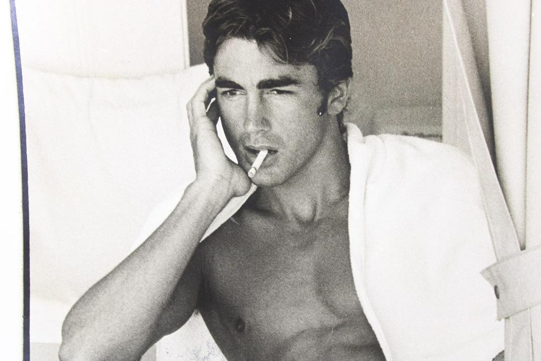 Bruce Weber Photograph; Shirtless Male in Bathing Suit: Bruce Weber, American Photographer b. 1946. This lot includes three photographs of a male model in a striped bathing suit, smoking a cigarett. Quantity: 3 Size 14 x 11 in Photographer: Bruce Weber Con
