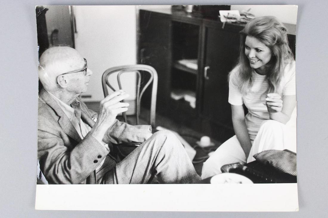 Photograph of Henry Miller and Ellen Burstyn: This is a great photograph of the author Henry Miller sitting with the actress Ellen Burstyn. Quantity: 1 Size 9.25 x 11.75 in Photographer: unknown Condition: (1 to 5) 3Photographs from the archive o