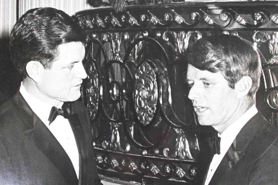 Ron Galella Photograph; Robert F. Kennedy, Ted Kennedy: Ron Galella American Photographer 1931-2022. Single B&W photograph of Robert F. Kennedy speaking with another unidentified man. Undated but from 1968-1983. Quantity: 1 Size 11 x 13 in Photographer: Ro