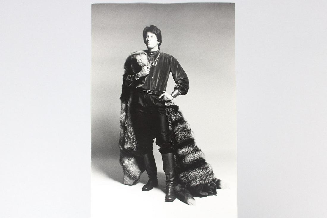 Francesco Scavullo Photograph; Male Fashion Model: Francesco Scavullo American Photographer 1921 - 2004. Single B&W photo of a Male Fashion Model with tall boots and a fur cape. Undated but are 1968-1983. Quantity: 1 Size 13.75 x 9 in Photographer: Fr