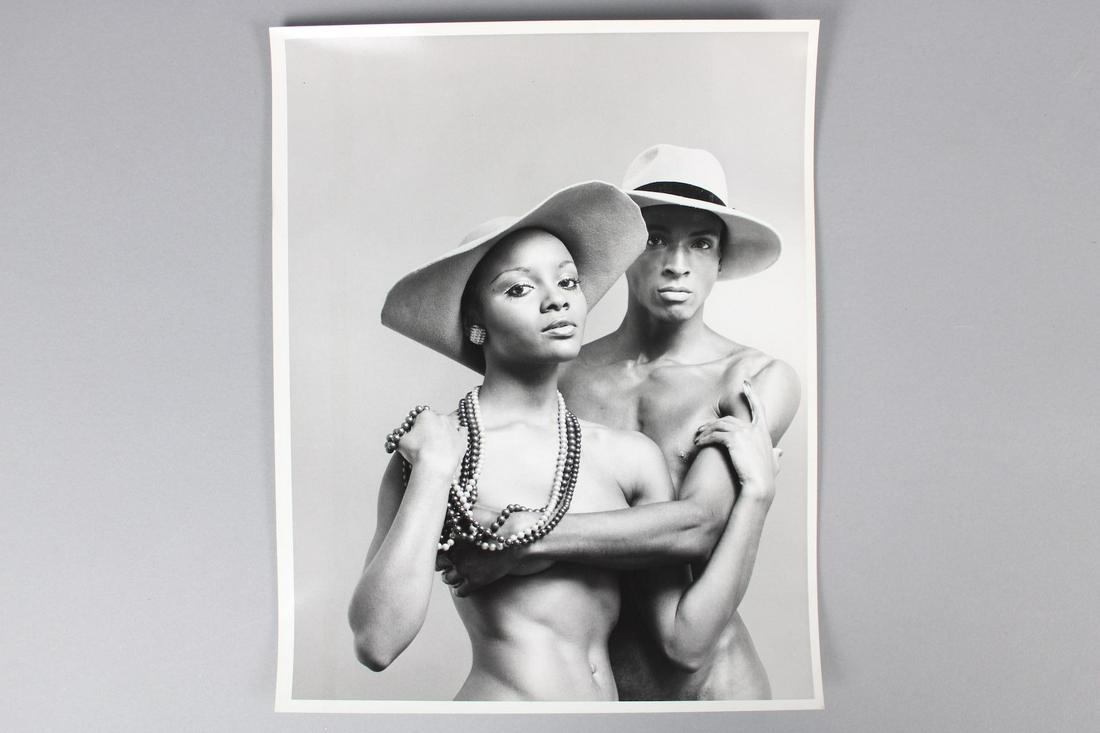 Kenn Duncan Photographs; Portrait of Shirtless Black Couple Wearing Hats: Kenn Duncan American Photographer 1928 -1986. This is a fantastic photograph of a black couple wearing wide brimmed hats. This photograph is 2 of 2. Quantity: 1 Size 14 x 11 in Photographer: Kenn Dunc