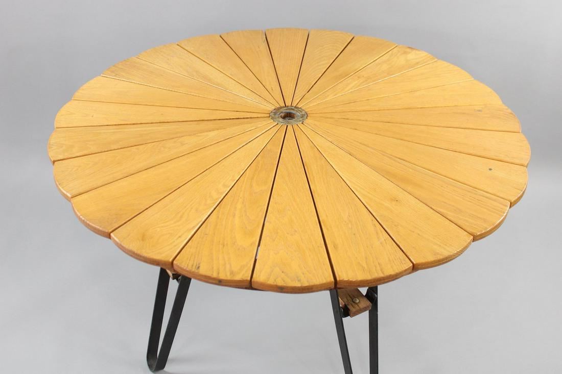 Mid Century Modern Outdoor Patio Wood "Petal" Table by Budoff: Mid Century Modern Outdoor Patio Wood "Petal" Table by Budoff. This elegant outdoor garden table has a petal shaped top and wrought iron, pin shaped legs. It has a hole in the center for an umbrella. 