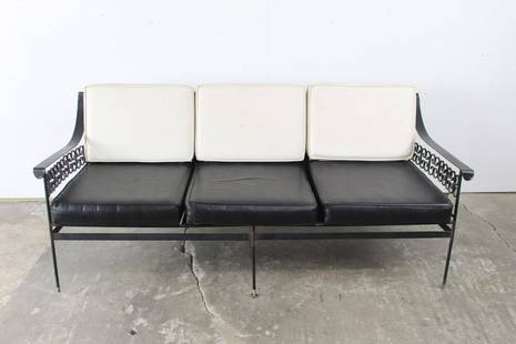 Mid Century Modern Wrought Iron Black and White Vinyl Sofa, Arthur Umanoff: Mid Century Modern Wrought Iron Black and White Vinyl Sofa, Arthur Umanoff. This sofa would be perfect for a screened in porch. One split to the back of the cushion.Dimensions are 29 in h x 70 in w x