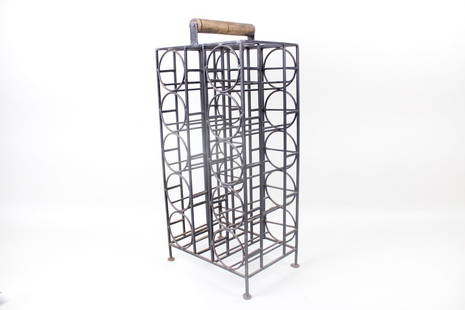 Mid-Century Modern Arthur Umanoff style Iron & Wood Wine Rack: Mid-Century Modern Arthur Umanoff style Iron & Wood Wine Rack. Small iron tabletop wine rack with wooden handle holds 10 bottles of wine.Dimensions are 26.5 in h x1 2.5 in w x 8.75 in d. Condition is