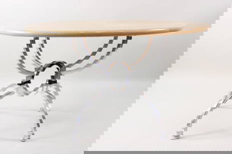 Postmodern Jay Spectre 'Eclipse' Dining Table: Postmodern Jay Spectre 'Eclipse' Dining Table. A round wooden tabletop is supported by a metal spider like base with 4 legs. This table has very small remnants of the original tag, this is attributed