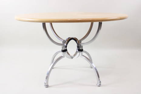 Postmodern Jay Spectre 'Eclipse' Dining Table: Postmodern Jay Spectre 'Eclipse' Dining Table. A round wooden tabletop is supported by a metal spider like base with 4 legs. This table has very small remnants of the original tag, this is attributed