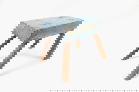 Primitive Blue Folk Art Stool: Small Blue Folk Art Stool. This small primitive stepstool or child's stool has a squared edge seat top and angled legs, painted a light blue on top. Dimensions are 7 in h x 9.5 in w x 7.5 in d. Condit