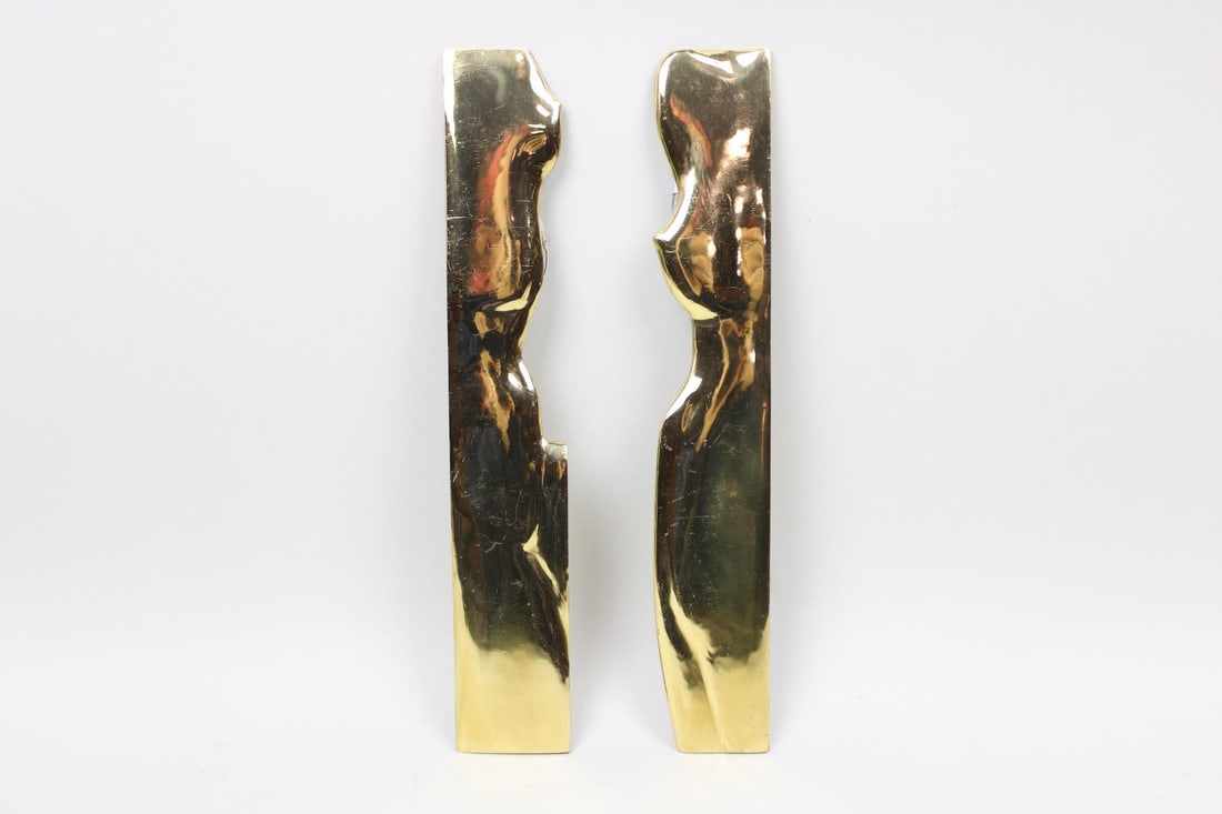 Pair of Mid-Century Modern Male & Female Wall Sculptures, Signed: Pair of Figural Male & Female Wall Hanging Sculptures, Signed. These vertical metal artworks depict abstract cropped profiles of nude bodies and are strung in back for hanging. Signed on back and date