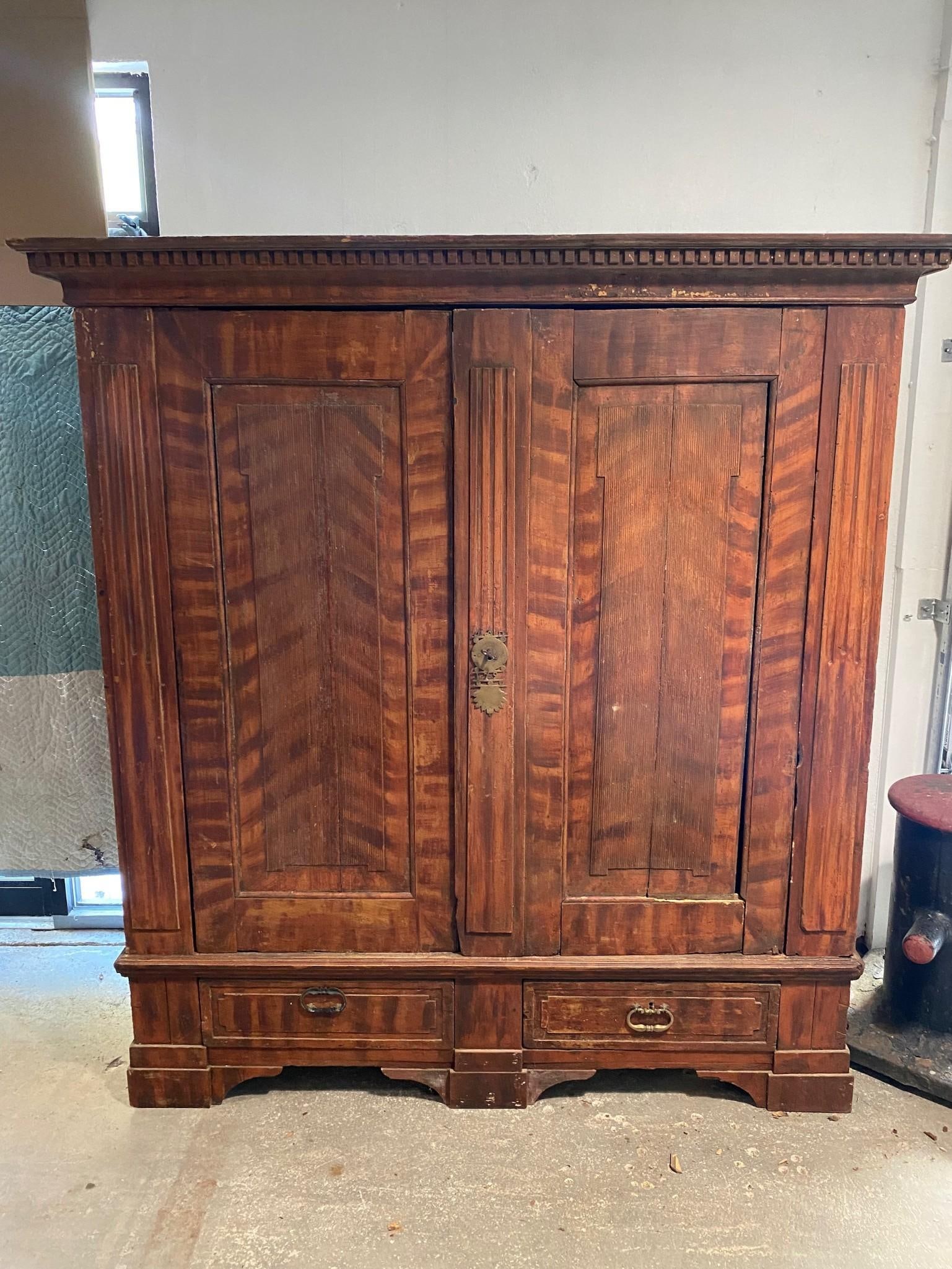Antique Kas Cabinet with Hand-Painted Tigerwood Finish: Antique Kas Cabinet with Painted Tigerwood. This is a very handsome kas wardrobe cabinet that breaks down to 7 pieces. It has a hand-painted, faux tigerwood finish and ornate brass pulls and hardware.
