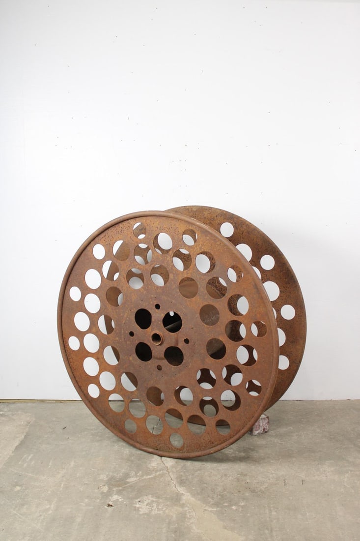 Large Industrial Perforated Steel Spool: Large Industrial Perforated Steel Spool. This could lay flat and be used as a low coffee table as well. Very interesting size, construction and design. Dimensions are 48 in h x 48 in w x 18 in d. Cond