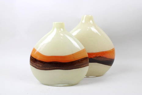 Pair of Minimalist Hand Blown Case Glass Vases: Pair of Minimalist Hand Blown Case Glass Vases. These wide and slim vessels have a wavy brown and orange stripe across the cream colored background and a narrow bud vase opening. Dimensions are 10-12