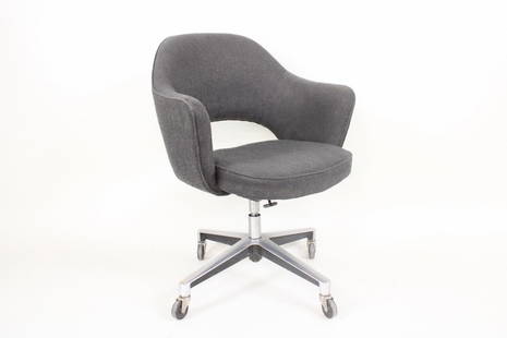 Mid-Century Modern Eero Saarinen Executive Chair, Knoll: Mid-Century Modern Eero Saarinen Executive Chair, Knoll. Rolling armchair on wheels upholstered in a grey fabric with curved back and arms, on a metal base with adjustable seat height. No maker's mark