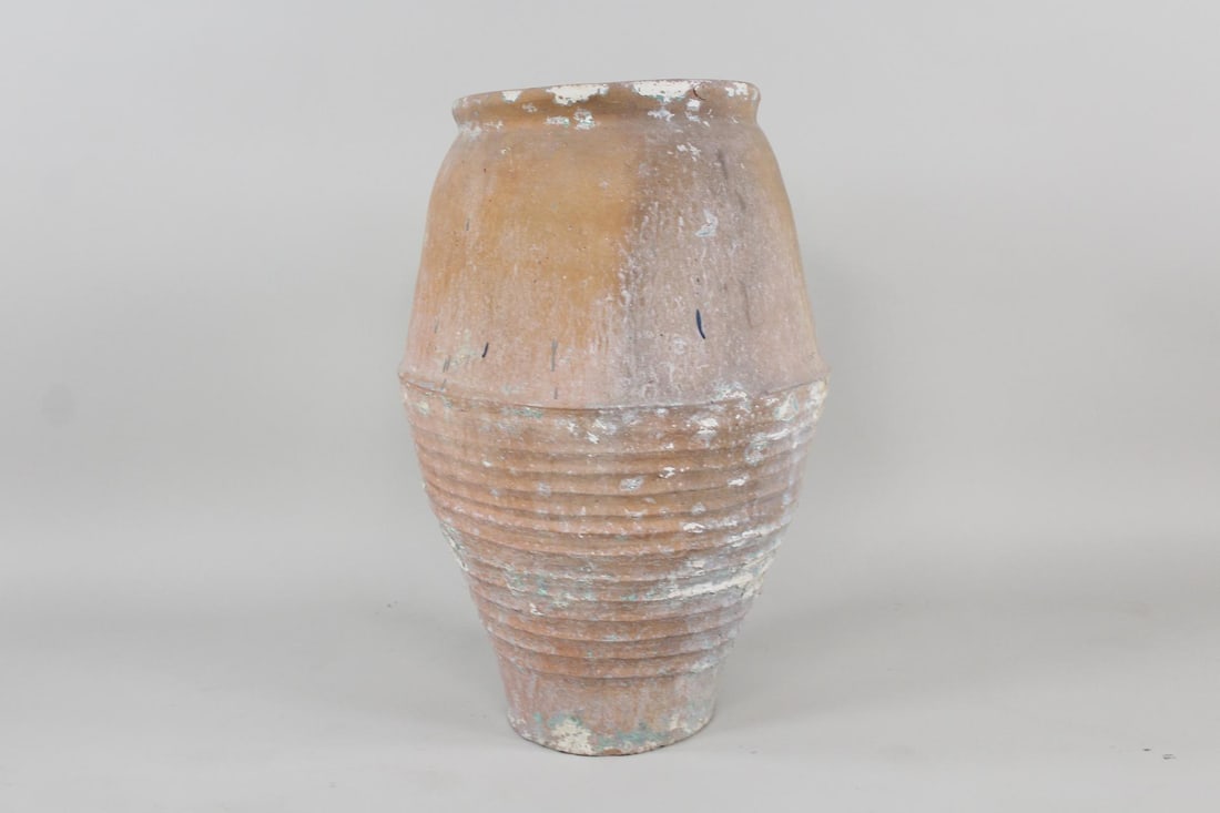 Large Antique Terra Cotta Olive or Wine Jar: Large Antique Terra Cotta Olive or Wine Jar or Planter. Style resembles 19th C. Spanish tinaja wine or olive oil jar with a narrow mouth and foot, no handles, and a wide belly. Ribbed or striated bott