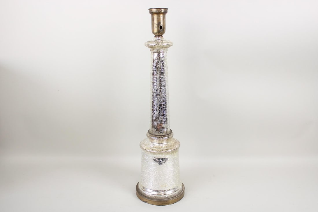 Tall Mid-Century Modern Crackle Mercury Glass Lamp: Tall Mid-Century Modern Crackle Glass Lamp. Lamp is made of mirrored crackle glass, with brass base and socket. Needs to be rewired. Dimensions are 27 in h x 6.75 in w x 6.75 in d. Condition is good t