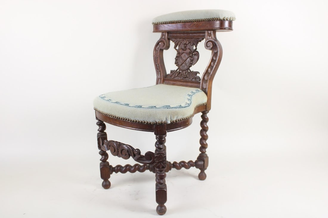 19th C Carved Wood Smokers Chair with Blue Upholstery: 19th C Carved Wood Smokers Chair with Blue Upholstery. Chair has ornately carved back, blue upholstered seat and an upholstered storage compartment on top of the seat. Dimensions are 31.5 in h x 18 in