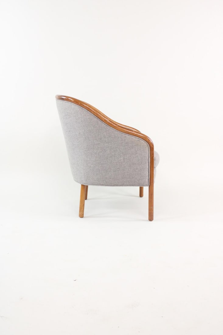 Ward Bennett Curved Wood Armchair, Grey Upholstery: Ward Bennett Curved Wood Armchair, Grey Upholstery. This chair has a tubular wooden frame with short rounded legs and is upholstered in a grey fabric on seat and exterior. No maker's mark, tagged by C