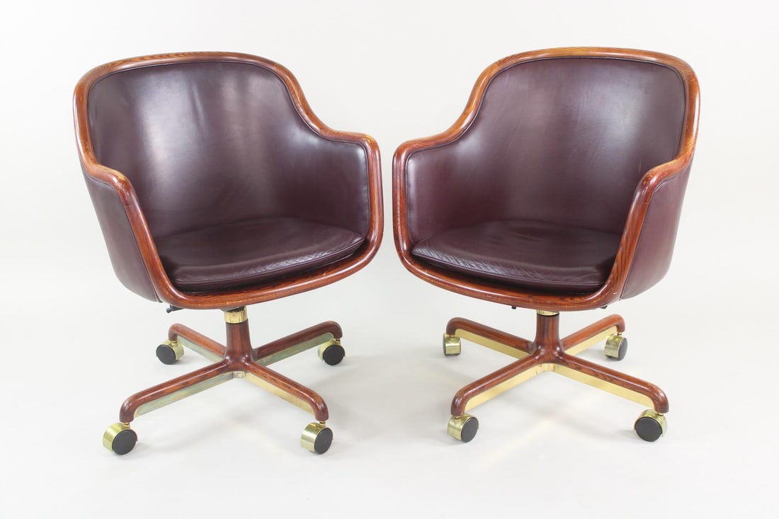 Pair of Ward Bennett Burgundy Leather & Brass Executive Chairs, Brickel, 2 of 2: Pair of Ward Bennett Leather Executive Office Chairs. These wood framed chairs have casters and nice burgundy plum colored leather. They are marked Ward Bennett. A tag underneath says covered in Knoll