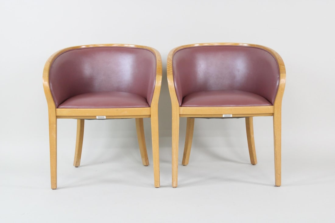 Pair of Mid-Century Modern Ward Bennett Executive Chairs, IBM, Brickel: Pair of Mid-Century Modern Ward Bennett Executive Chairs, IBM, Brickel. These two armchairs have raspberry colored vinyl upholstery on the seats and curved wooden frames. Marked underneath as Ward Ben