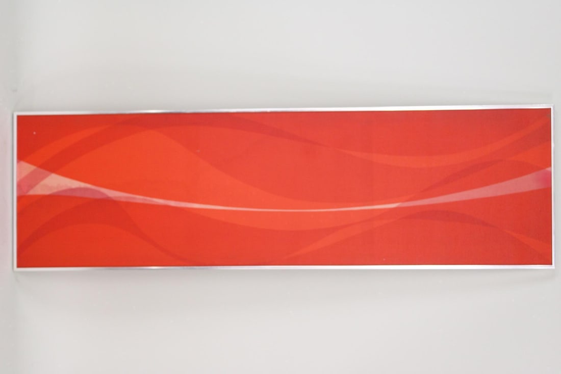 Mid-Century Modern Framed Tom Tru Red Fabric Wall Art for Raymor: Mid-Century Modern Framed Tom Tru Red Fabric Wall Art. Screen printed fabric with red waves and a white band across the center. Framed in silver metal and with a Tom Tru, Lambertville NJ tag on the ba