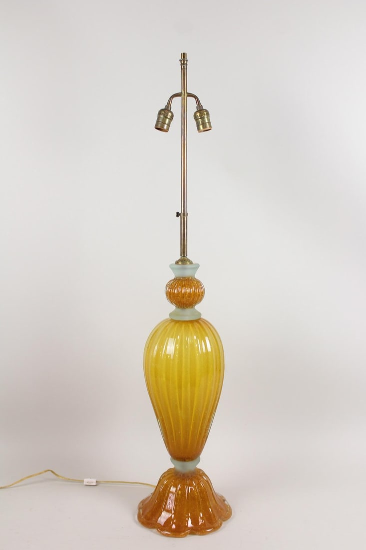 Mid-Century Modern Amber Murano Art Glass Lamp: Mid-Century Modern Amber Murano Art Glass Lamp. Great Murano glass form with frosted interval details, 2 sockets and bullicante (bubbles throughout) glass. Dimensions are 41 in h x 9 in w x 9 in d. Co