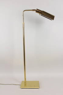 Mid-Century Modern Koch & Lowy Brass Floor Lamp: Mid-Century Modern Koch & Lowy Brass Floor Lamp. Lamp with tent shaped adjustable brass shade, marked at the joint, "OMI KOCH LOWY," and on a weighted rectangular foot. Dimensions are 38 in h x 6