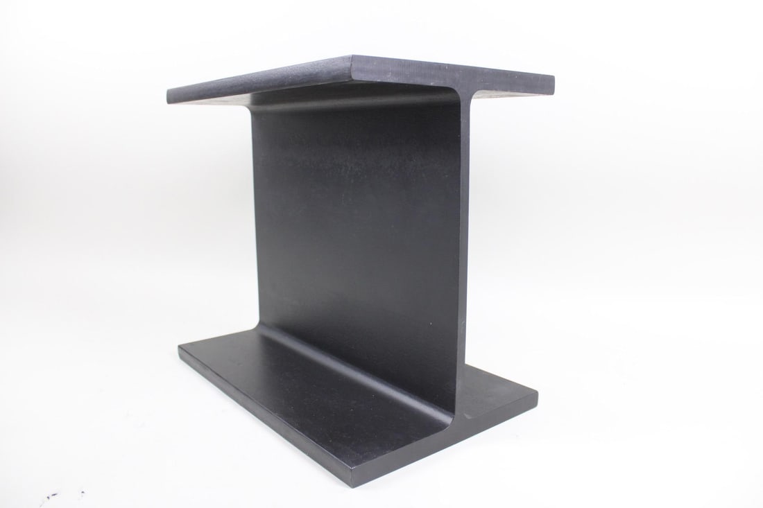 I-Beam Side Table Manner of Ward Bennett: I-Beam Side Table Manner of Ward Bennett. This low industrial sculptural display stand has a black finish. No makers mark. Dimensions are 14.5 in h x 10.25 in w x 16 in d. Condition is good with minor
